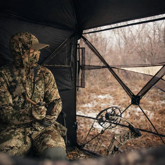 Hunter seated inside Muddy Prevue 3-Man ground hunting blind