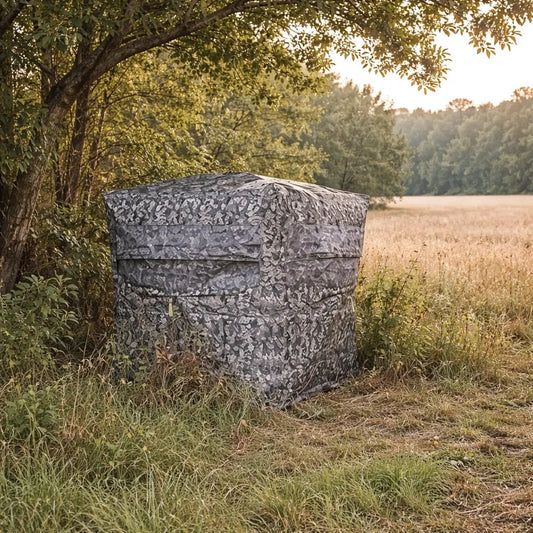 Hawk Reveal ground hunting blind positioned in field edge environment for deer hunting