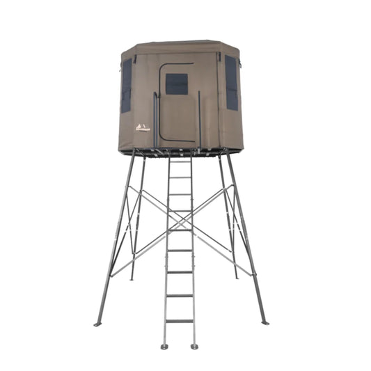Millennium Treestands Q200 Buck Hut Shooting House, straight-on front view of tan fabric blind on elevated steel tower wit…