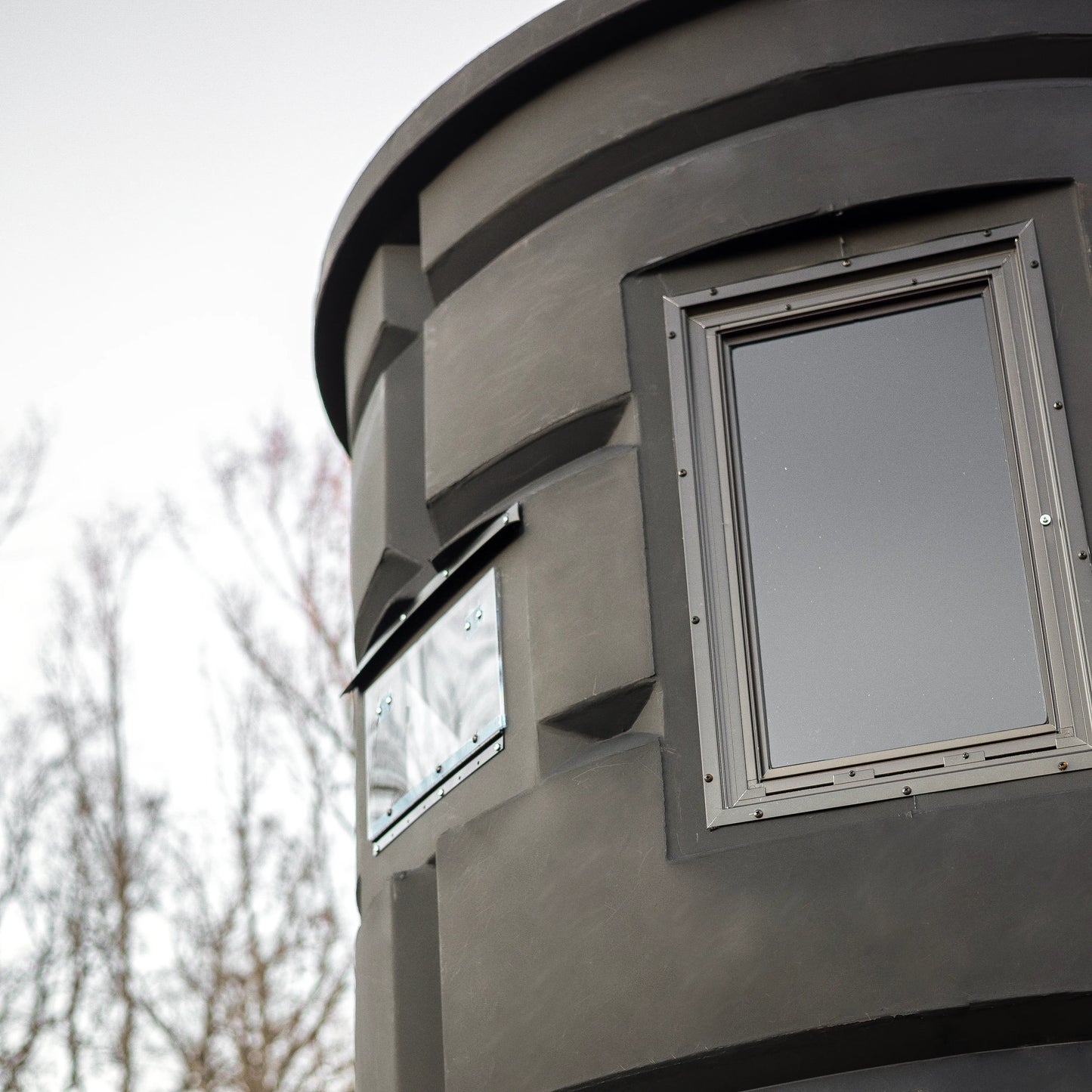 Side window of the Sportsman’s Condo Bow Condo deer hunting blind, highlighting the archery-friendly design