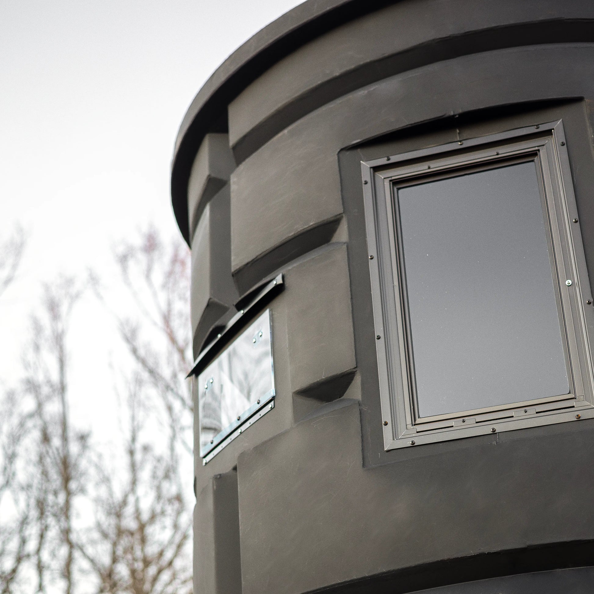 Side window of the Sportsman’s Condo Bow Condo deer hunting blind, highlighting the archery-friendly design
