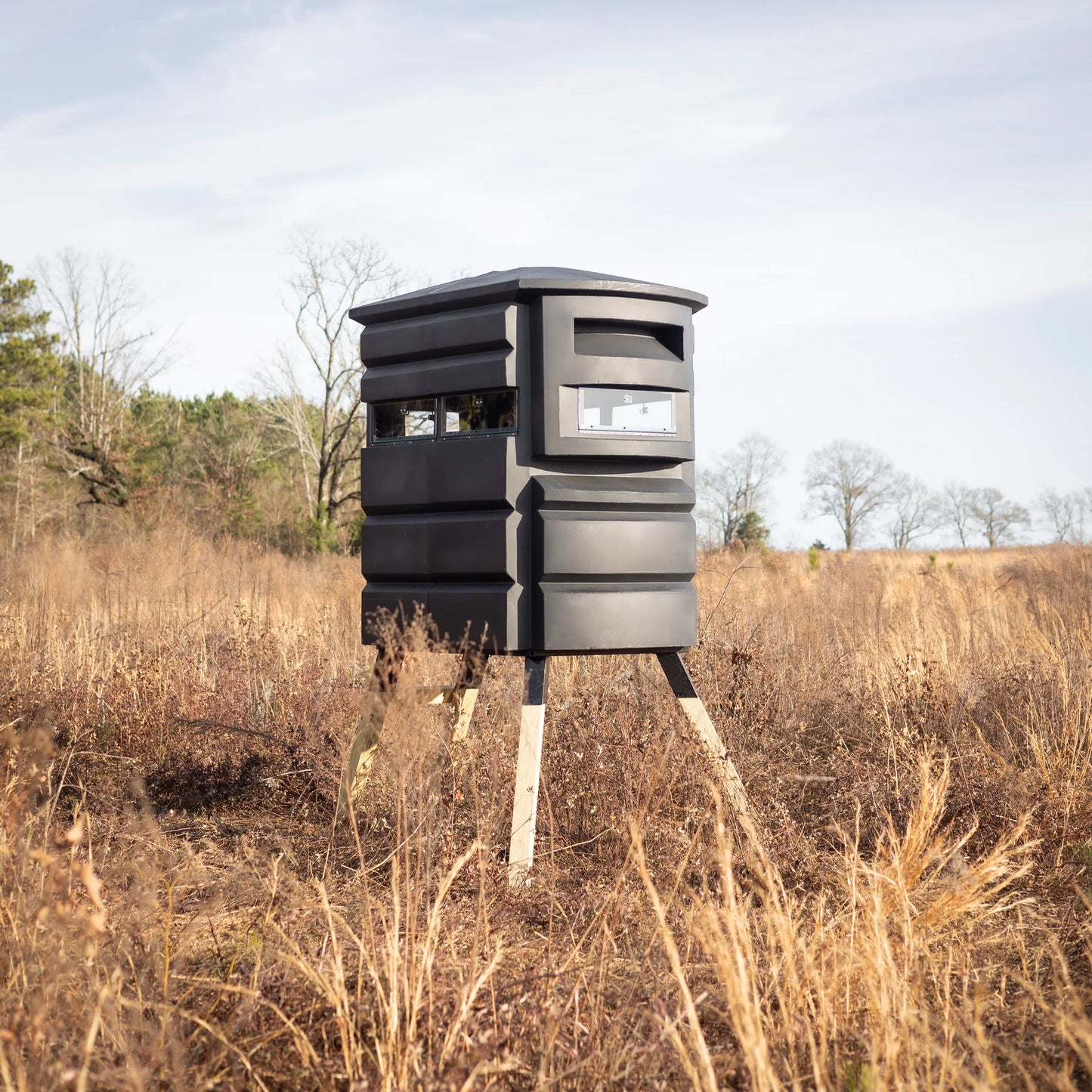 Sportsman’s Condo SC2 4x6 deer hunting blind in open terrain, front-side angle