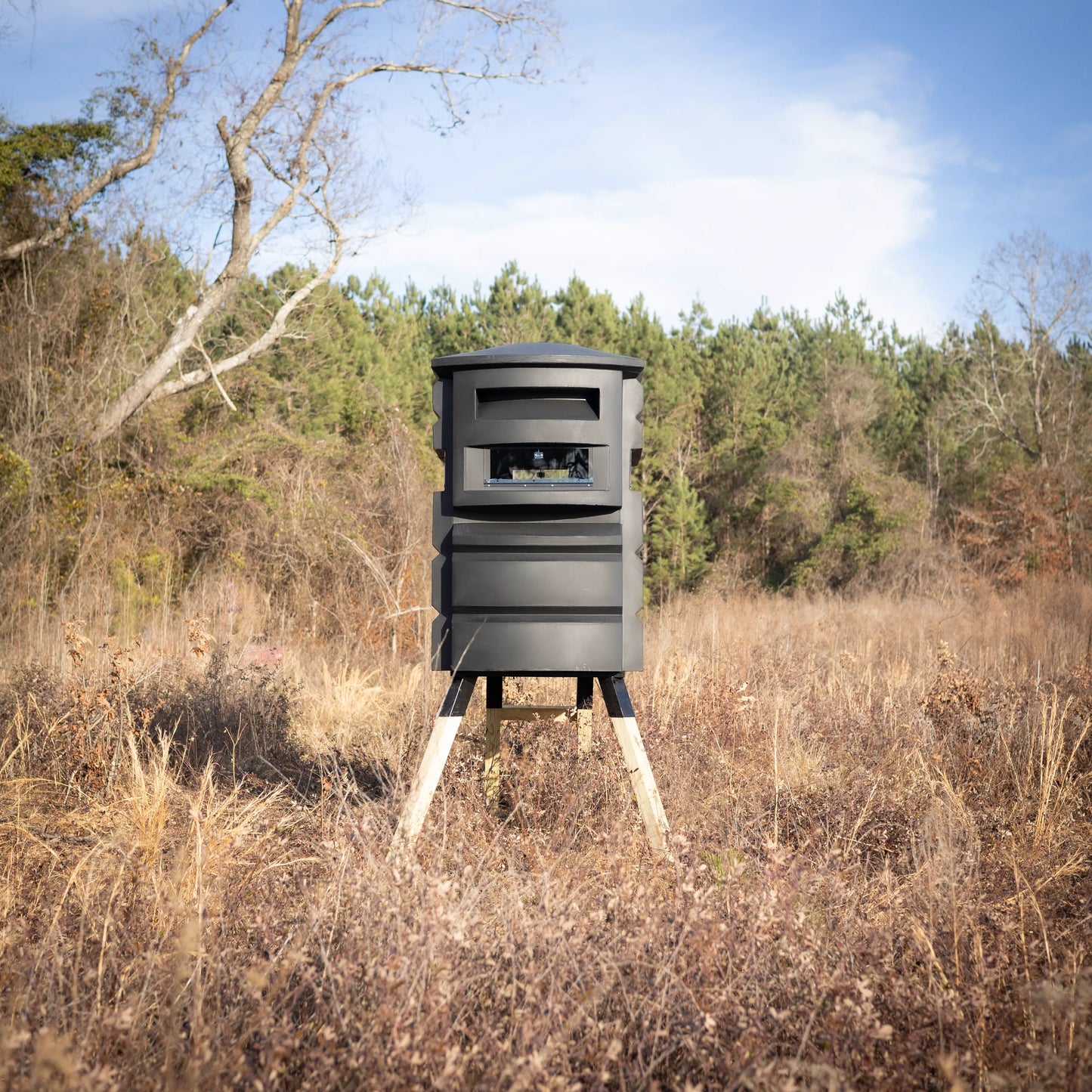 Sportsman’s Condo SC2 4x6 deer hunting blind in a wooded field clearing