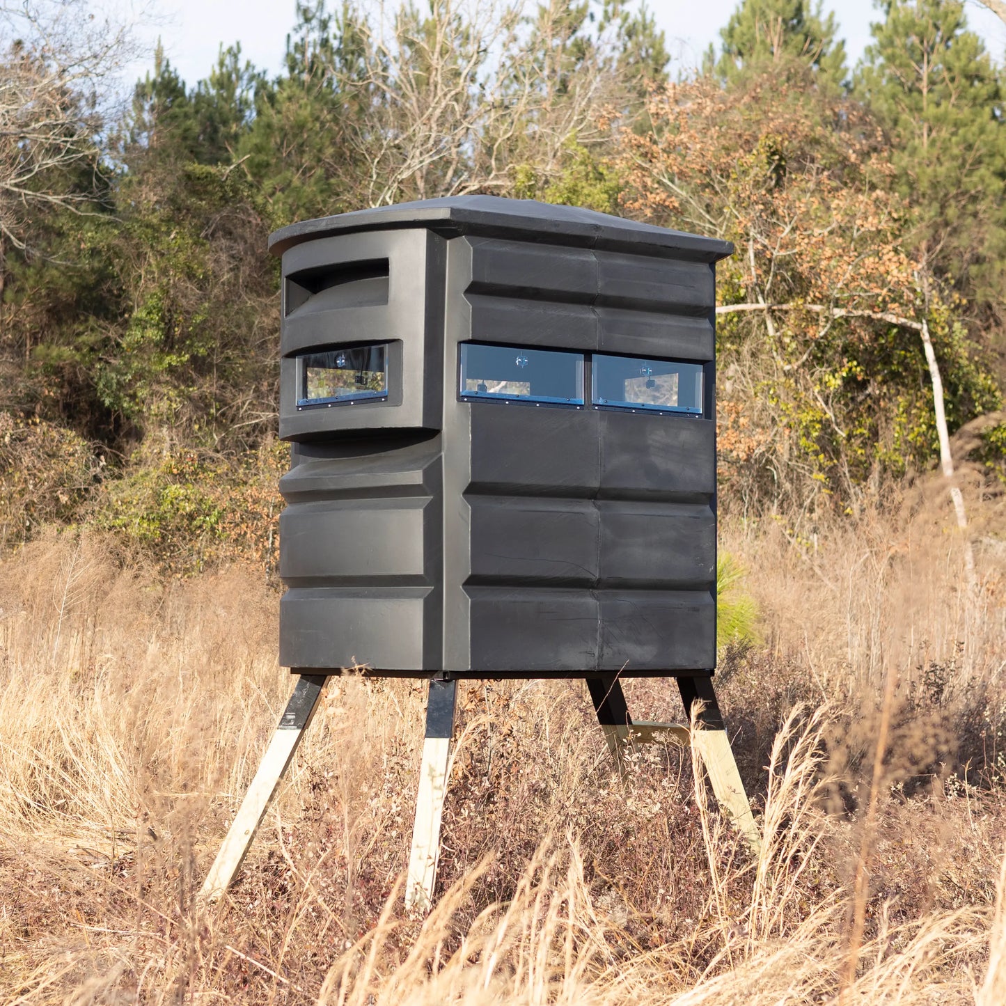 Sportsman’s Condo SC2 4x6 deer hunting blind, side view in tall foliage