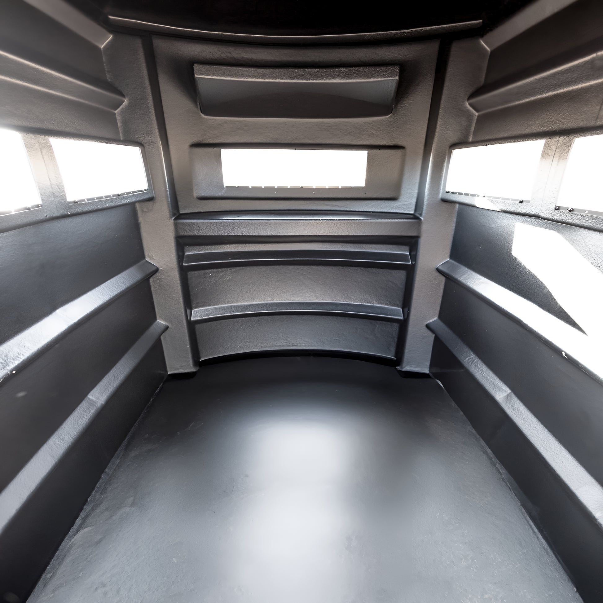 Interior view of the Sportsman’s Condo SC2 4x6 deer hunting blind showing windows and molded walls