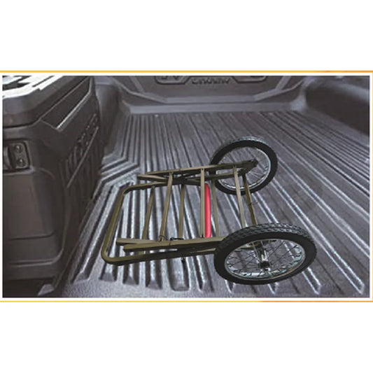 Trophy Treestands Trophy Game Cart shown folded down in a pickup truck bed for transport