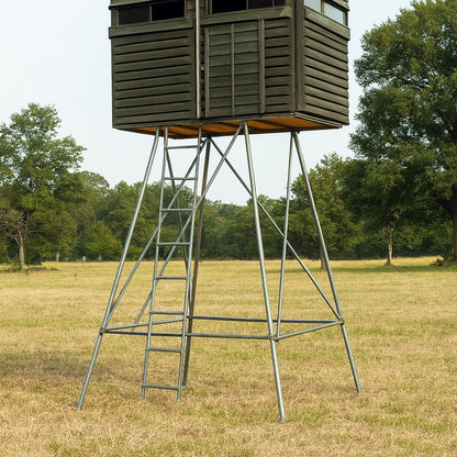 4x8 deer hunting blind on a steel tower stand in open pasture, offering maximum elevation for hunting concealment.

