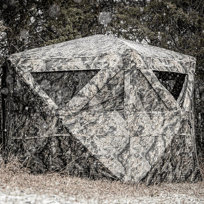 Ameristep Pro Series Insulated 59x59 pop-up ground blind with camouflage pattern set up in a snowy forest field