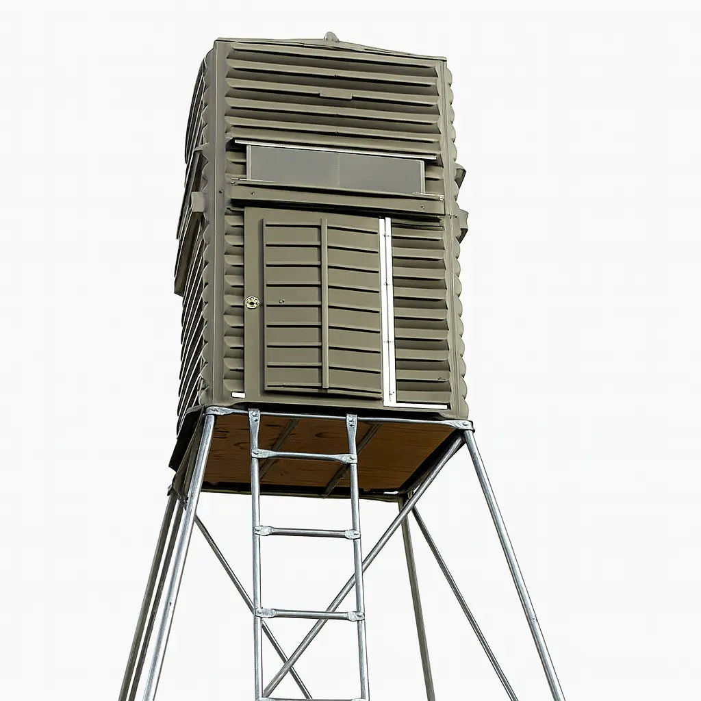 The Blynd 4x4 Deer Hunting Blind elevated on a tall steel stand, shown on white background for clear product detailing.

