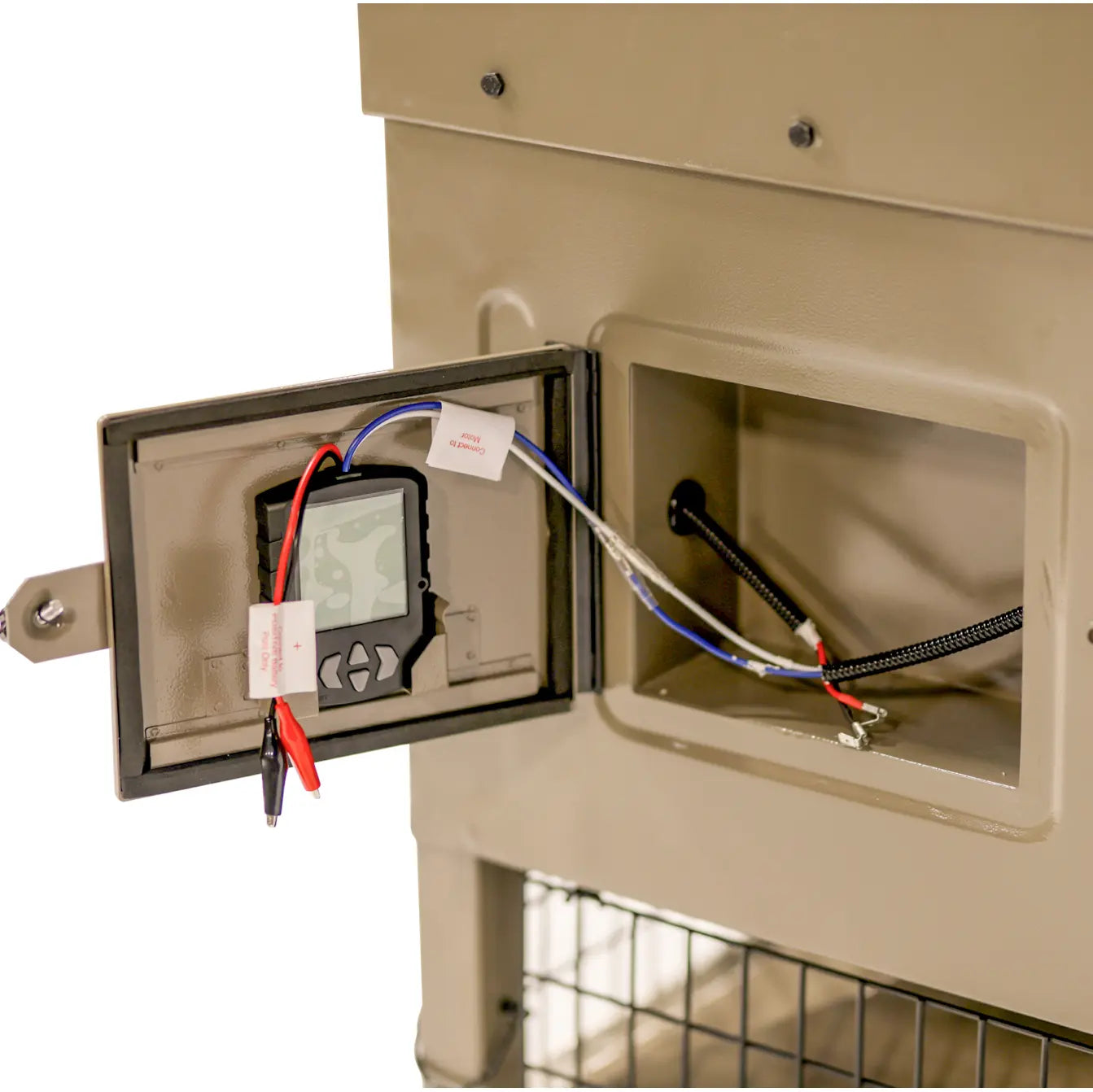 Boss Buck 300lb Stand & Fill Automatic Sled Deer Feeder showing interior control box — weatherproof housing with 12-volt timer and spinner plate for consistent feed delivery.