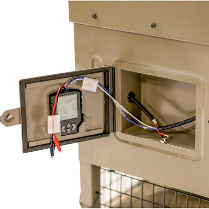 Boss Buck 300lb Stand & Fill Automatic Sled Deer Feeder showing interior control box — weatherproof housing with 12-volt timer and spinner plate for consistent feed delivery.