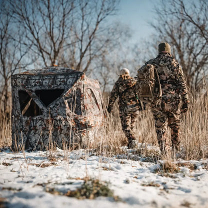 Muddy Epic Camo Infinity ground hunting blind set up in snowy field environment