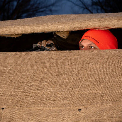 Muddy Bale Blind interior window view looking out toward field