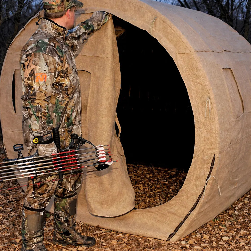 Hunter entering Muddy Bale Blind through front opening
