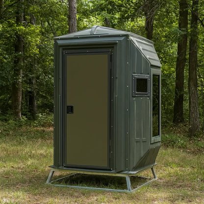 The Blynd 4x4 Bow Hunting Deer Blind with solid door and tinted windows, shown in a forest clearing for concealed bow hunting.