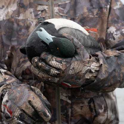 Detail of Avian-X TopFlight Bluebills drake decoy head and bill cradled in hunter's camo gloves