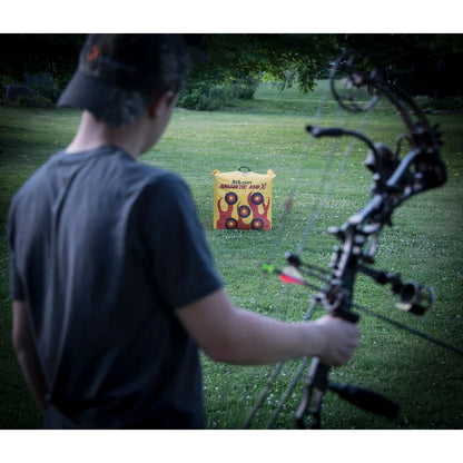 Big Shot Ballistic 450X bag archery target in backyard field, archer with compound bow aiming downrange
