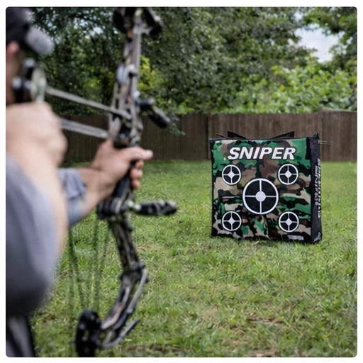 Archer shooting compound bow at Delta McKenzie Speedbag Sniper 20-inch archery bag target in backyard