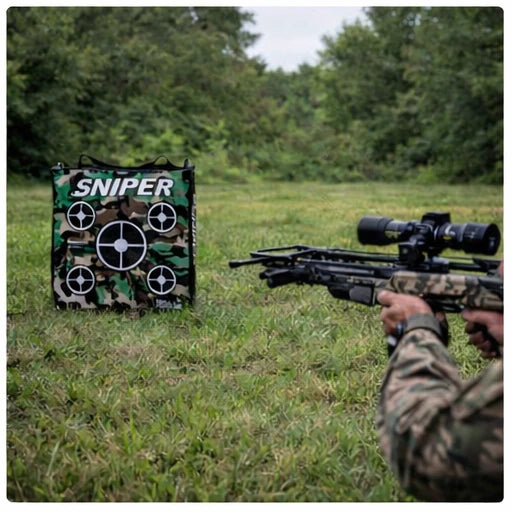 Crossbow shooter practicing on Delta McKenzie Speedbag Sniper 20-inch bag target in grassy field