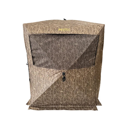 HARVST Outdoors Bow Hunter DM Ground Blind in Bottomland camo, front view with mesh window and Harvst logo