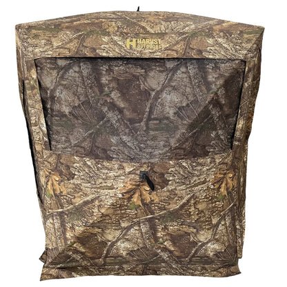 HARVST Outdoors Bow Hunter DM Ground Blind in Realtree Legacy, front view with mesh window and Harvst Outdoors logo