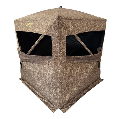 HARVST Outdoors Brushline STM Ground Blind in Bottomland camo, front three-quarter view with windows open