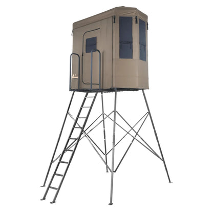 Millennium Treestands Q200 Buck Hut Shooting House, front three-quarter view showing tan fabric blind on elevated steel to…