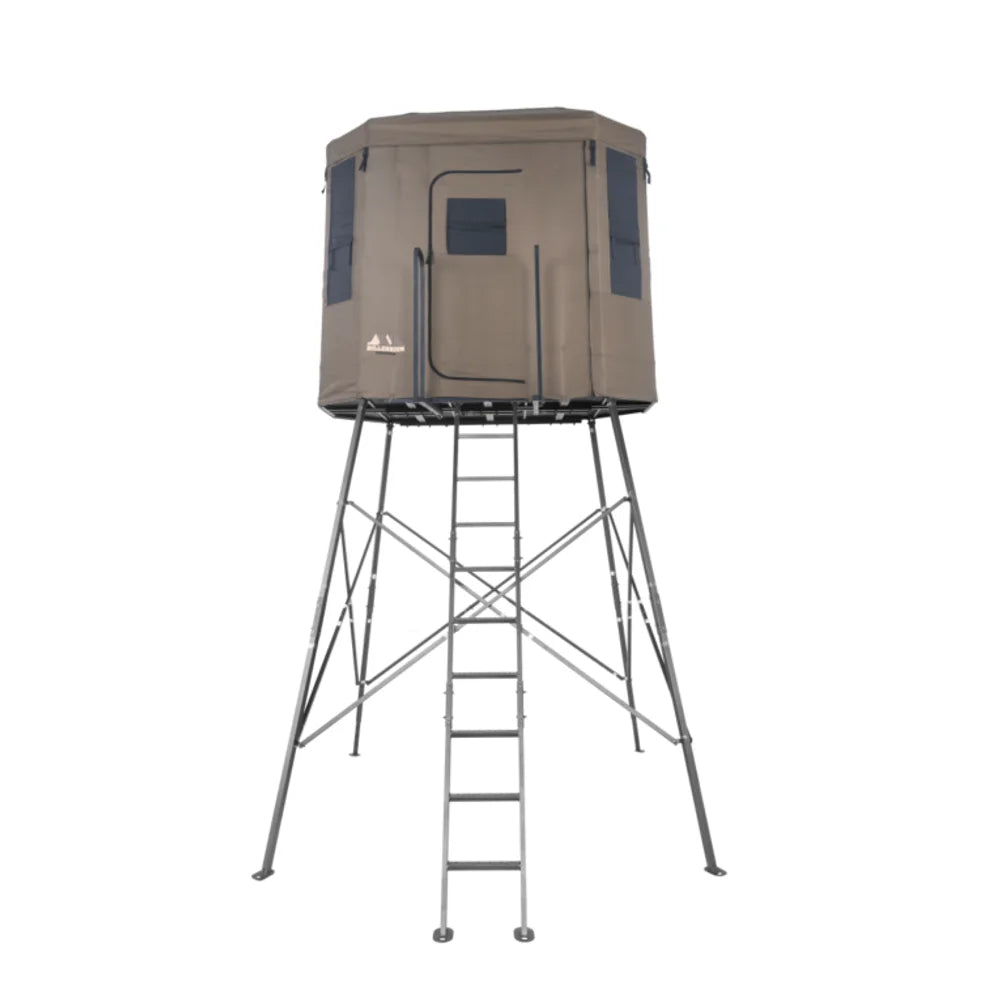 Millennium Treestands Q200 Buck Hut Shooting House, straight-on front view of tan fabric blind on elevated steel tower wit…