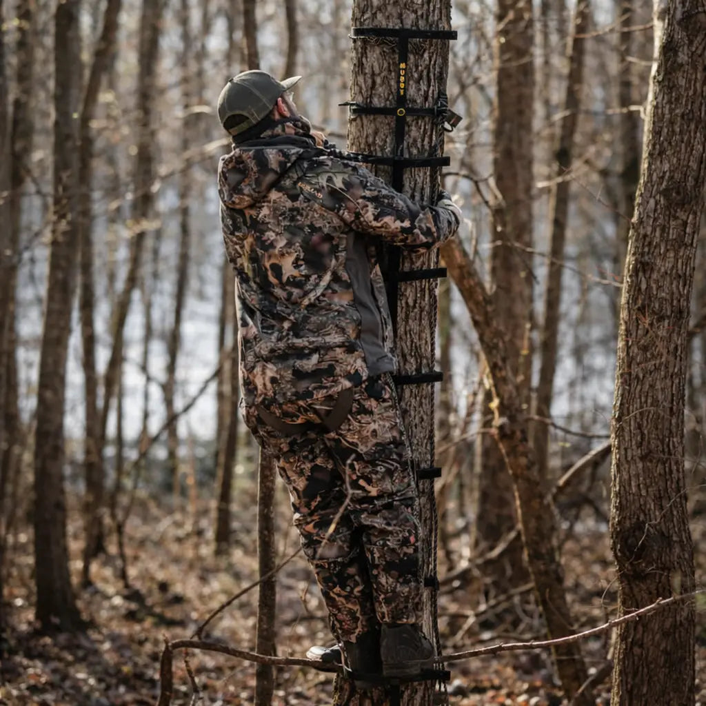 Hunter climbing tree using Muddy Quick-Stick XL climbing sticks