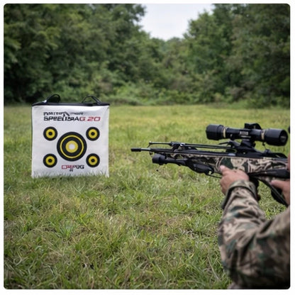 Crossbow shooter practicing on Delta McKenzie Speedbag 20 target in grassy field