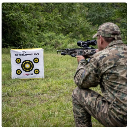 Hunter aiming crossbow at Delta McKenzie Speedbag 20 bag target in open field