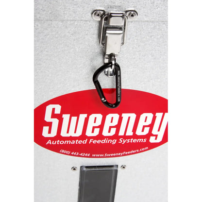 Sweeney 100 lb Scatter Feeder silver, close-up of stainless latch with carabiner and Sweeney brand logo decal
