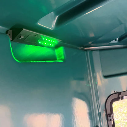 Titan 12V Light Kit mounted to ceiling shelf of green hunting blind with green LEDs illuminated