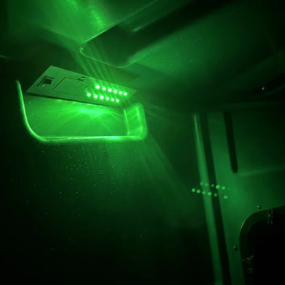 Titan 12V Light Kit glowing green at night inside hunting blind, illuminating interior