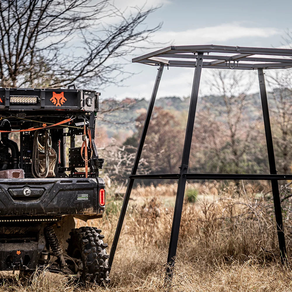 Titan Hunting Blinds 8 ft. tower frame set up in field beside a UTV during assembly