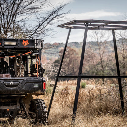 Titan Hunting Blinds 8 ft. tower frame set up in field beside a UTV during assembly