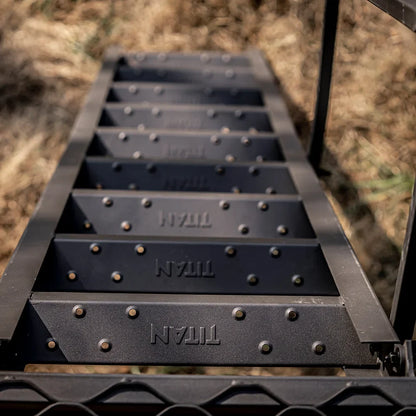 Close-up of Titan-branded ladder steps with riveted treads on the 8 ft. tower