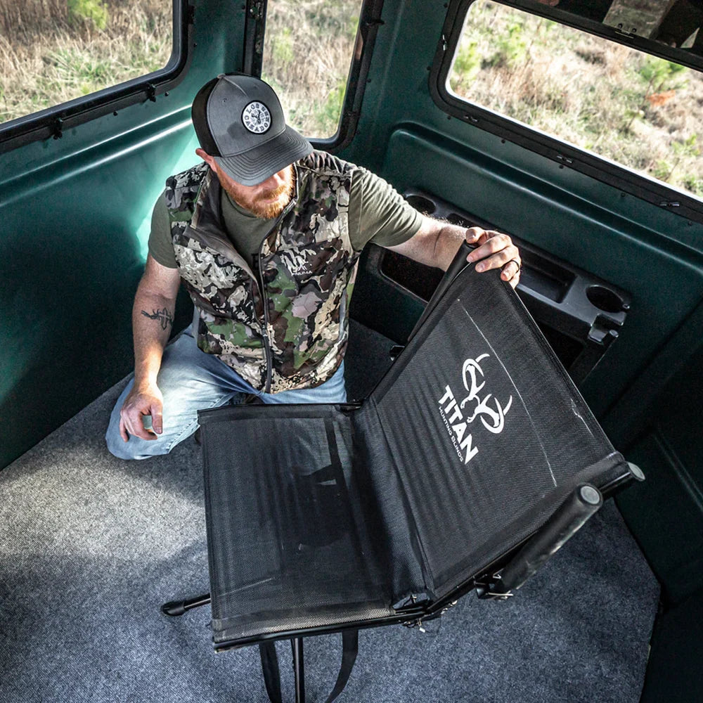 Hunter folding Titan Hunting Blinds Swivel Chair seat inside a hunting blind