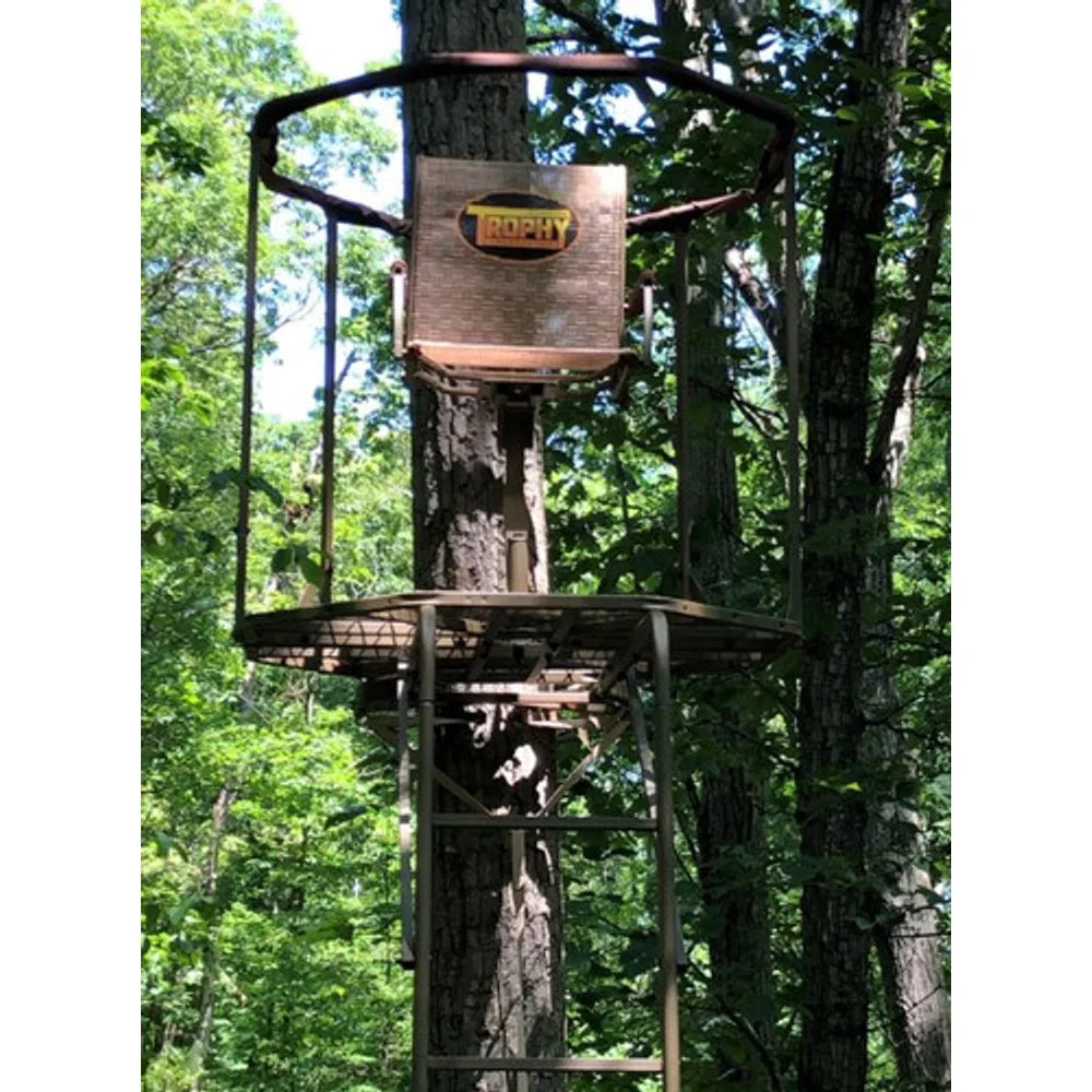 Trophy Treestands Aimer 360 ladder stand installed on a tree in the woods, in-use lifestyle view