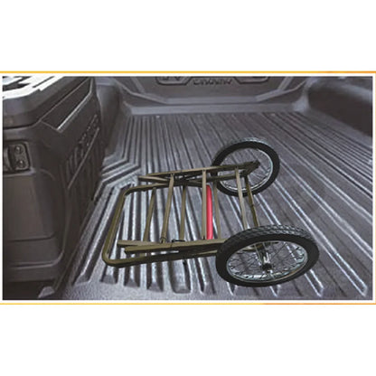 Trophy Treestands Trophy Game Cart shown folded down in a pickup truck bed for transport