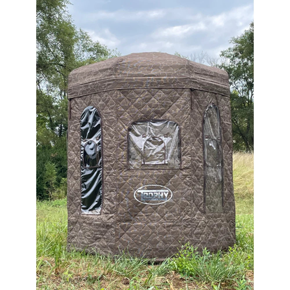 Trophy Tree Stands D-Lux Blind TT818 quilted camo ground blind, front view set up in grassy field