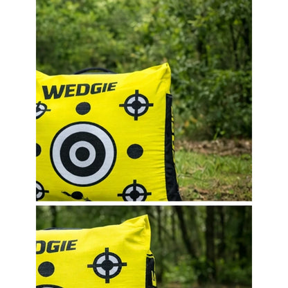 Yellow Wedgie product with black and white target design against a green outdoor background.